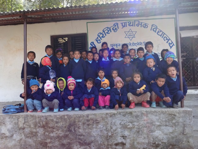 Students of Harisiddhi Primary School wearing their new sweaters